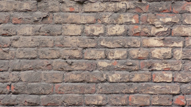 Old brick wall made of red brick Crack in the wall