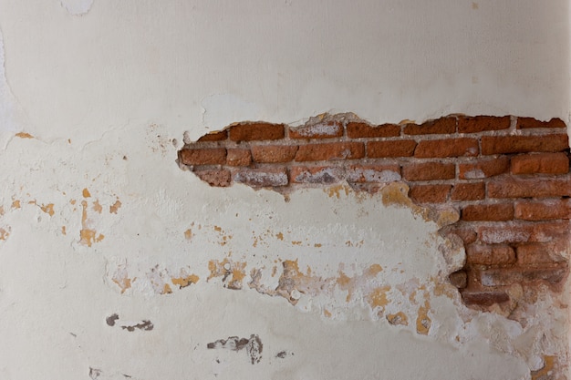 Foto vecchia struttura del muro di mattoni. superficie verniciata in distressed wall