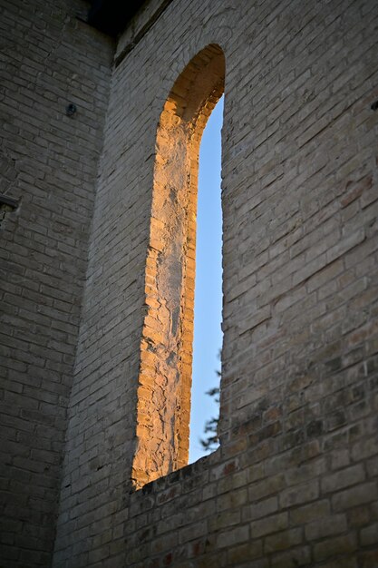 Old brick wall with a window