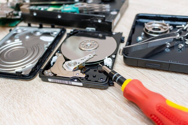 Old broken hard disk drives composition in a repair recovery service