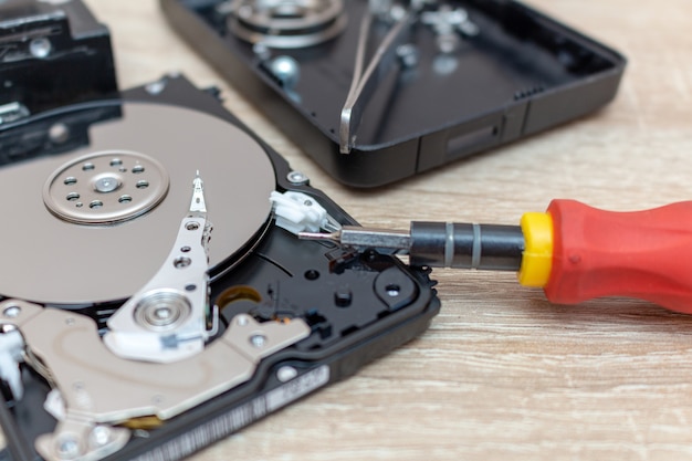 Old broken hard disk drives composition in a repair recovery service.