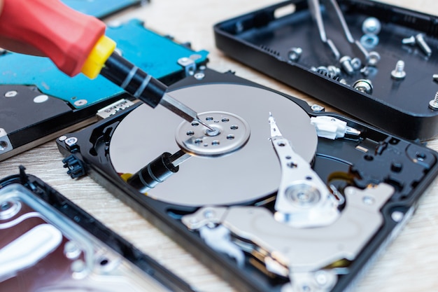 Old broken hard disk drives repair recovery in service close up