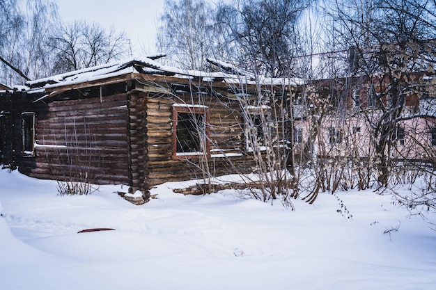 Old broken house in winter