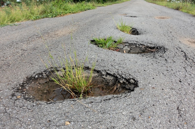 old broken road with cracked asphalt