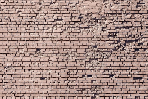 Old brown brick wall for the vintage textured background or for wallpaper on the display