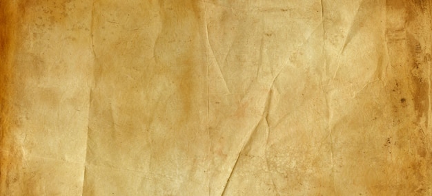 Old brown crumpled paper texture background. Vintage wallpaper