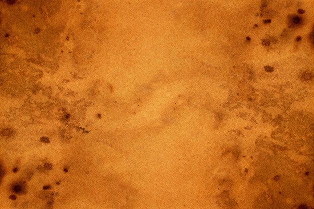 Old brown paper grunge background. Abstract liquid coffee color texture.