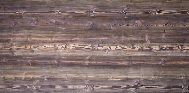 old brown scratched rough weathered wooden background of boards