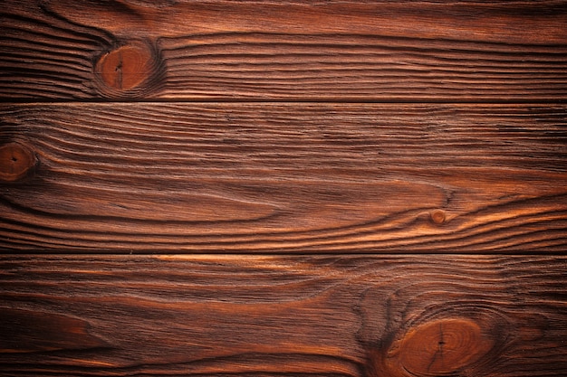 Old brown wooden wall, detailed background photo texture. Wood plank fence close up.