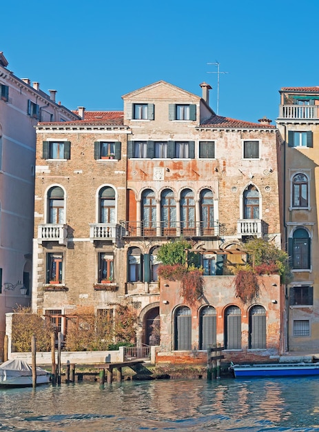 Old building by Grand Canal shore in Venice