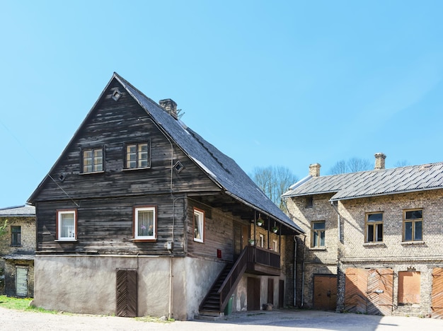 Old building with flag in Ventspils. It is a city in the Courland region of Latvia. Latvia is one of the Baltic countries