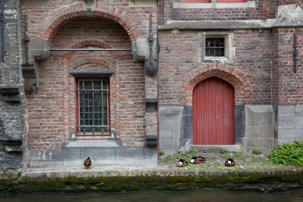 The old building with the Red door and a window on the water channel