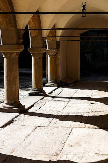 Old building with stone columns under sunlight