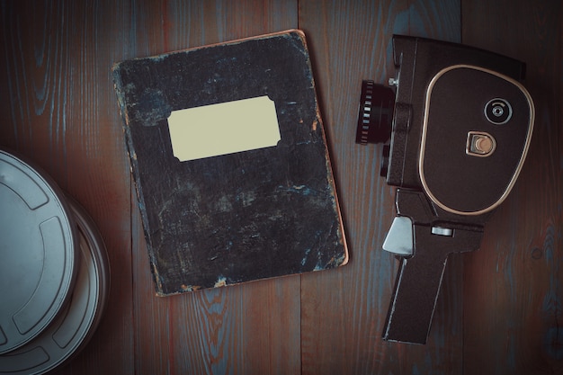 Old camera,boxes of film and a notebook