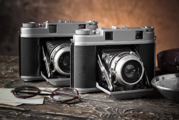 Old camera on an old background on a close-up table