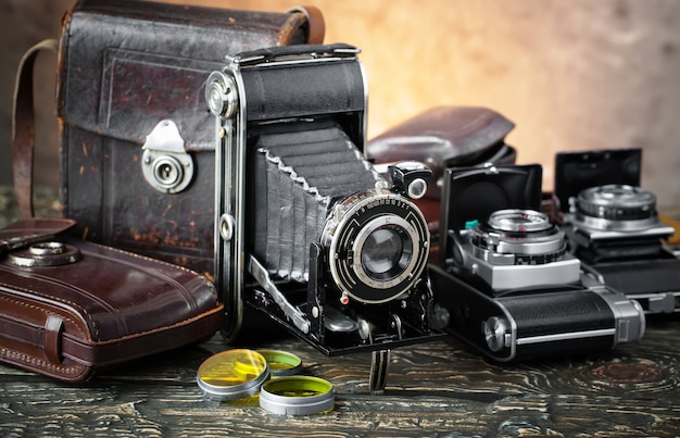 Old camera on an old background on a close-up table