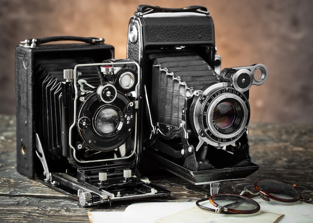 Old camera on an old background on a close-up table