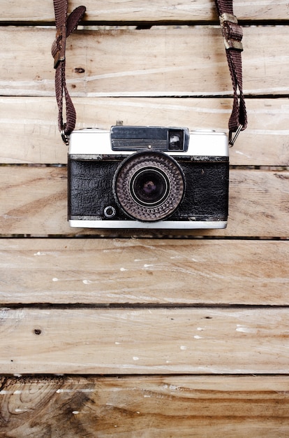 Old camera and on wooden table, Space for text or image for design work