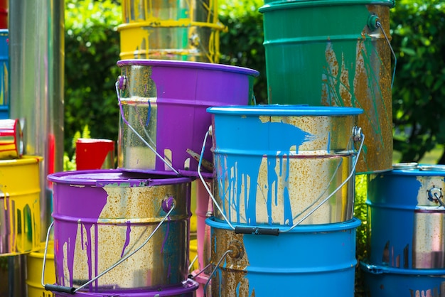 Old cans of paint, with rust and streaks