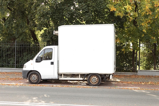 An old cargo van parked on a city street