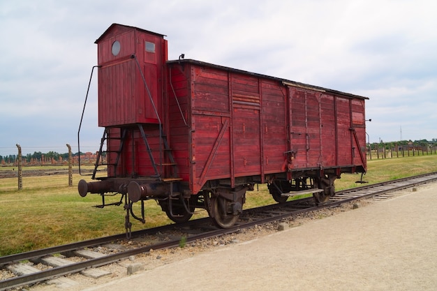 Old carriage on rails in Birkenau or Auschwitz concentration camp