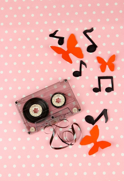 Photo old cassette on pink background