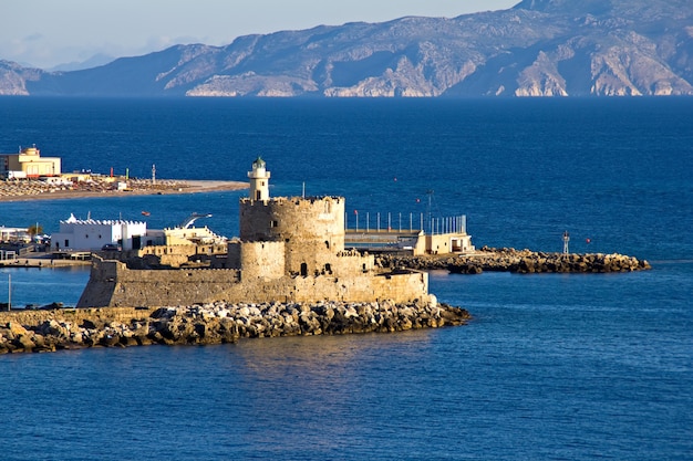 Old castle and lighthouse on Rhodes island Greece