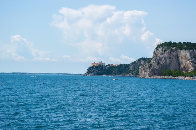 Old castle on a rock against the sea