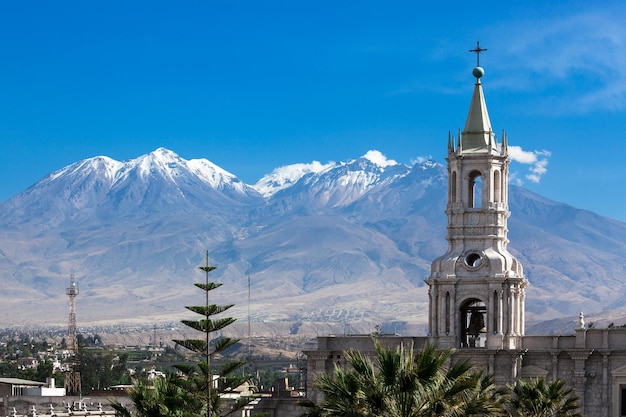 Old cathedral and volcano