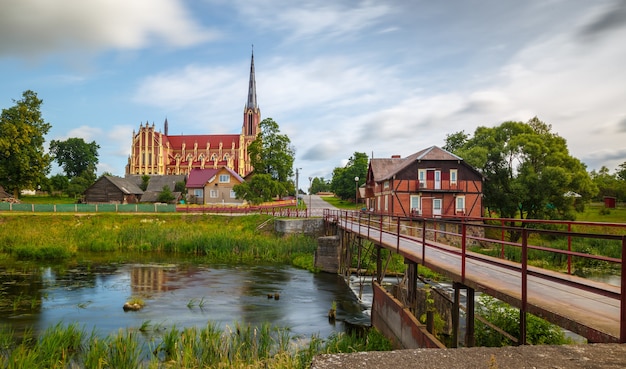 Old catholic church and water mill in Herviaty, Belarus