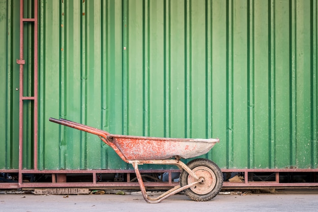 The old cement cart with the green wall.