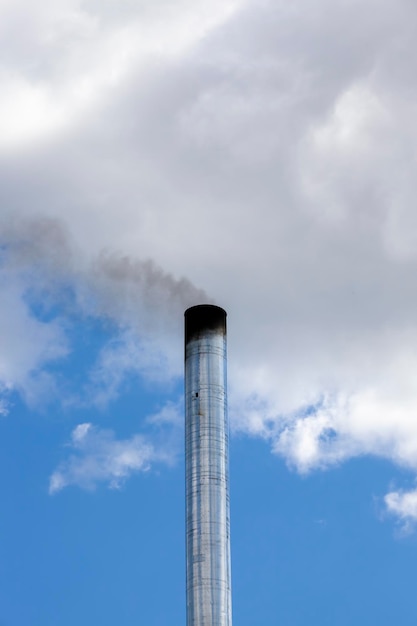 Old chimney on the roof of the building