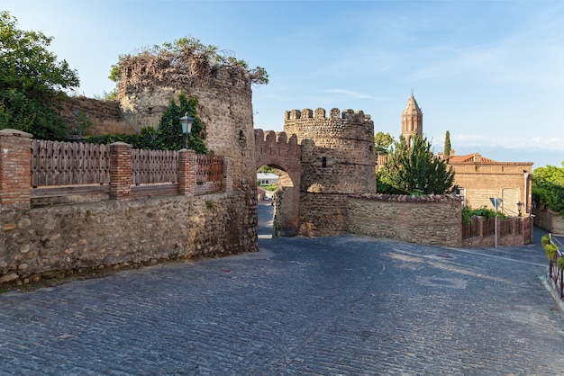 Old city wall from stones with towers round a city Sighnaghi Kakheti Georgia It is City of Love