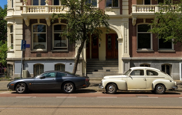 Old classic car and new modern car