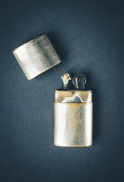 Photo old classic vintage lighter on a dark background