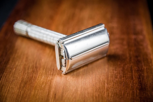 Old classic vintage shaver razor on a wooden background