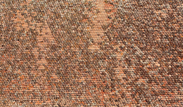 Old clay tiles on the roof background