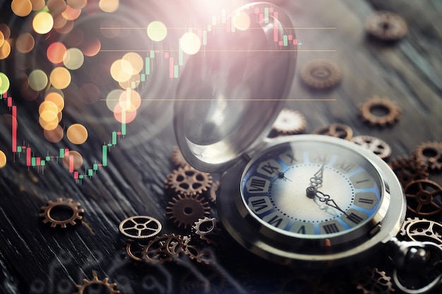 Old clock macro Old mechanical clock gears and cogwheels on wooden background