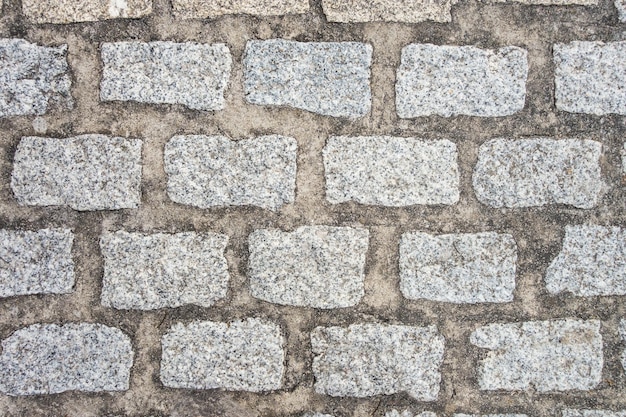 Old cobblestone pavement background texture