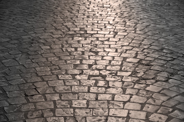 Photo old cobblestone street warm light background texture