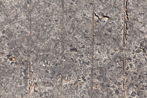 Old collapsing reinforced concrete slabs laid for pedestrian and transport traffic