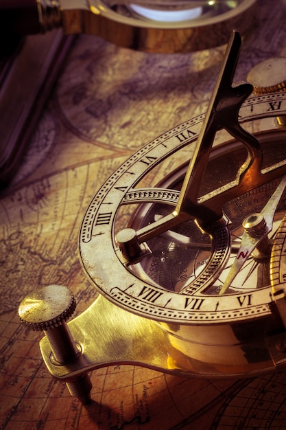 Старый компас над древней картой