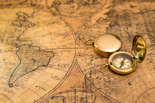 Old compass on vintage map