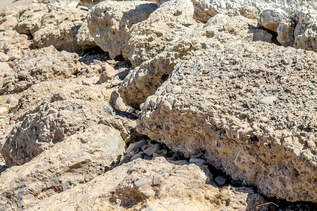 Old concrete stones on a dry bank