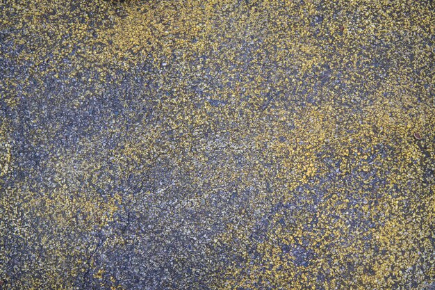 Old concrete texture painted blue gold can be used as a background