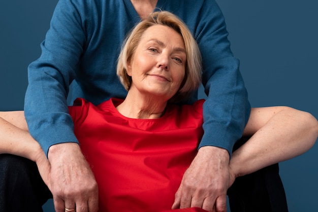 Old couple posing in studio front view