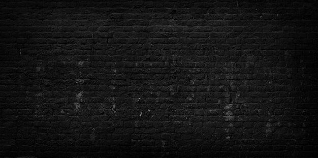 Old cracked black brick wall background