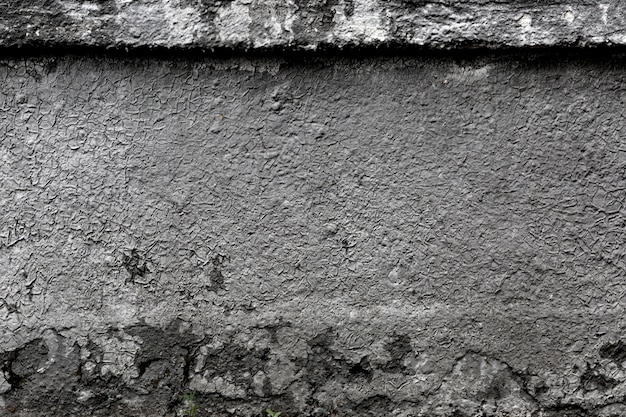 Old cracked grey wall.