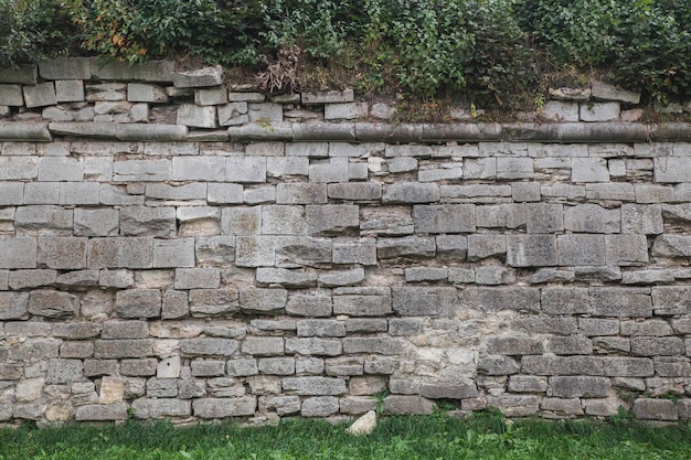 Old crumbling stone wall in an abandoned castle