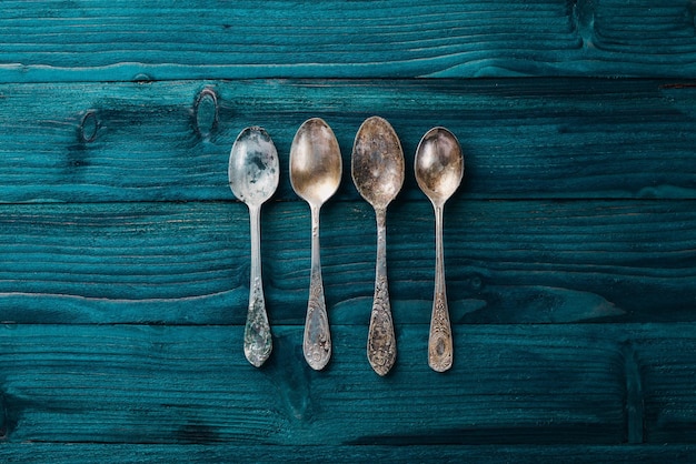 Old cutlery On a wooden background Top view Free space for text